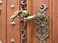 doorhandle representing the Coat of Arms of the Schwarzenberg family (a scarecrow eating a moor's head)