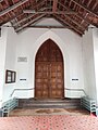 The west door of Holy Trinity Cathedral which mentions Bailey laid the foundation stone in 1839