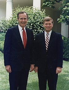 A color photograph of two men, Dan Quayle and George H. W. Bush, standing next to each other
