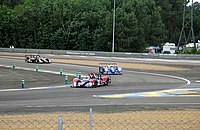 A group of Le Mans Prototypes at Mulsanne Corner during the early laps. LMPs at Mulsanne.jpg