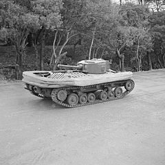 Valentine DD tank with screen lowered and gun pointing towards the rear of the vehicle.