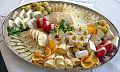 A platter with cheese and garnishes