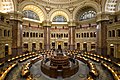 Photograph of the elaborately detailed Great Hall of the Library of Congress, with grand stairways and a finely worked ceiling.