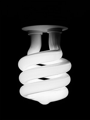 Black and White image of a compact fluorescent light bulb.