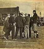 Milton Portmann with Western Reserve coaches on field sidelines in 1910 (Person furthest right)