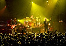 The Verve performing at Madison Square Garden in 2008. From left to right: Nick McCabe, Peter Salisbury, Richard Ashcroft, and out of sight, Simon Jones