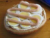 Kalles Kaviar atop an egg sandwich Kalles Kaviar (cropped).jpg