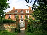 Manor House and attached Garden Walls (north West Wall incorporated into the Forge and the Coach House)