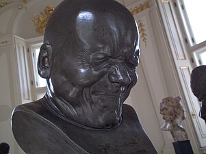 An Arch-Rascal (no. 33 in a character head series); by Franz Xaver Messerschmidt; after 1770; alabaster; height: 38 cm; Österreichische Galerie Belvedere, Vienna, Austria[42]