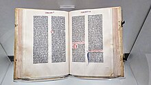 Photo of the Gutenberg Bible behind display case.