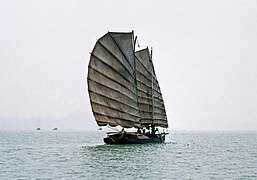 Small junk sailing in Halong Bay, Vietnam