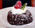 A Chocolate cake with strawberry and cream