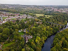 The village of Trevor, showing the River Dee, Pontcysyllte Aqueduct, Trevor Basin and Llangollen Canal.