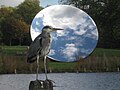 Sky Mirror, Kensington Gardens, London, with heron