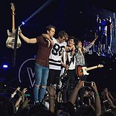 Color photograph of The Vamps on stage in April 2016