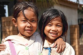 Two little Lao girls hugging.jpg