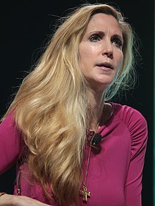 Ann Coulter smiling, with a blue wallpaper behind her.