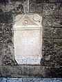 Stele romana sulla facciata della chiesa di San Pietro Roman stele in the facade of San Pietro church