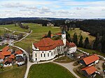 An aerial photo of a church in a countryside setting