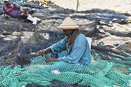 Fisherman repairing nets.jpg