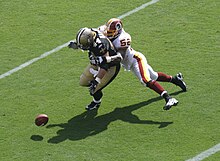 McIntosh tackling Mike Karney while playing against the Saints in the 2008 season. Rmcintosh 2008.jpg