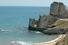 Stone walls partially immersed in the sea