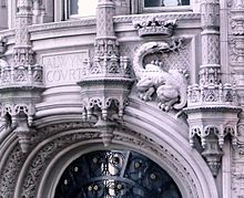 Terracotta detail of a crowned salamander over the doorway at the corner of 58th Street and Seventh Avenue Alwyn salamander jeh crop.jpg