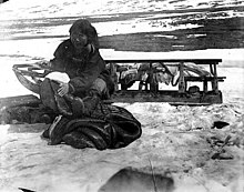 Native Alaskan woman dresses walrus skin