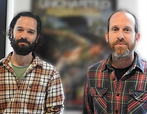 A 36-year-old man with curly black hair and a 37-year-old man with short brown hair smirking at the camera.