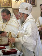 Placing Gospel Book onto Antimension at end of Liturgy.jpeg