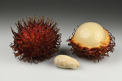 Rambutan utuh dan terbuka dengan bijinya. Buah ini berasal dari pohon tropis berukuran sedang dari keluarga Sapindaceae dan berasal dari Asia Tenggara. Nama "rambutan" berasal dari kata bahasa Melayu "rambut" yang mengacu pada bagian buahnya yang berbulu, ditambah dengan akhiran -an yang membentuk kata benda.