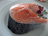 Cut of raw salmon showing bone in the center Kus lososa (2).jpg