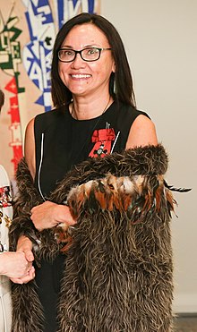 Portrait photo of a woman with glasses