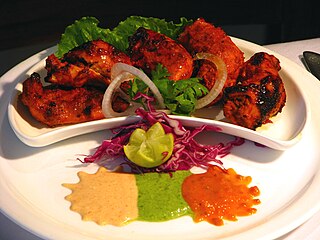 <span class="mw-page-title-main">Chicken tikka</span> Boneless chicken pieces cooked in a tandoor