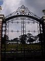 The front gate, topped by the coat of arms of the Philippines.