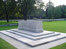 A rectangular stone on a multi-stepped stone platform. the words "Their name liveth for evermore" inscribed on the longer side of the stone.