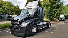 Black day cab Freightliner eCascadia