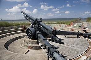 A replica captured Belgian Army 120 mm gun used as a battery gun in a dedicated circular parapet.