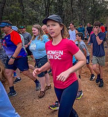 Runners of various ages, shapes, and genders participating in a parkrun event