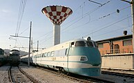 View of an ETR 401 parked at the station depot and of the station tower