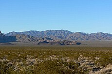 Valley's center-south, from east side. (North end of Highland Range (from east-southeast), McCullough Range massif beyond.)