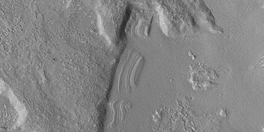 Close view of dipping layers along a mesa wall, as seen by HiRISE under HiWish program. Location is Ismenius Lacus quadrangle.