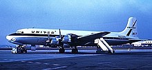 A United Airlines Douglas DC-7 four-prop airliner on an airport tarmac.