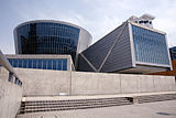 Suntory Museum, the parallelepiped intersecting the spherical body of the IMAX theatre, shown in profile