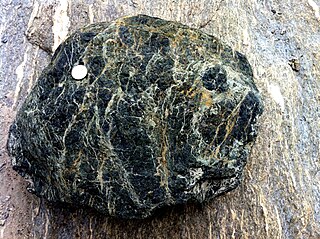 <span class="mw-page-title-main">Serpentinite</span> Rock formed by hydration and metamorphic transformation of olivine