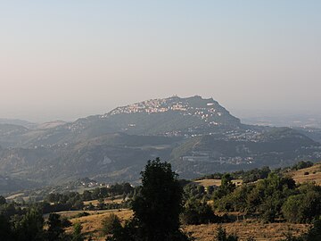 a remote view with Monte Titano and the three towers, village Murata