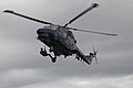 S-134: Danish navy helicopter (Westland Lynx) with a rescue swimmer, ready for insertion