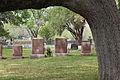 The graves of Lady Bird and Lyndon Johnson (his with flag) at family cemetery in the national historical park; the public is not allowed entry into the cemetery.