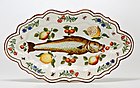 Polychrome majolica dish with paintings of a fish, flowers, and fruit. Lodi, Italija, 1751.