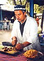 Image 24A man makes plov, the national dish of Tajikistan. (from Culture of Tajikistan)